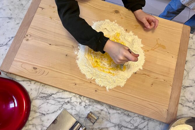 Bolognese Cooking Class with Margherita in the Historic Center - The meal setup: antipasto, wine, pollo alla cacciatora, and tiramisu