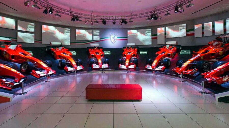 Maranello and Modena: Ferrari Museums Combo Tickets - Enzo Ferrari Museum in Modena: the yellow-hood building and the engine “sectors”