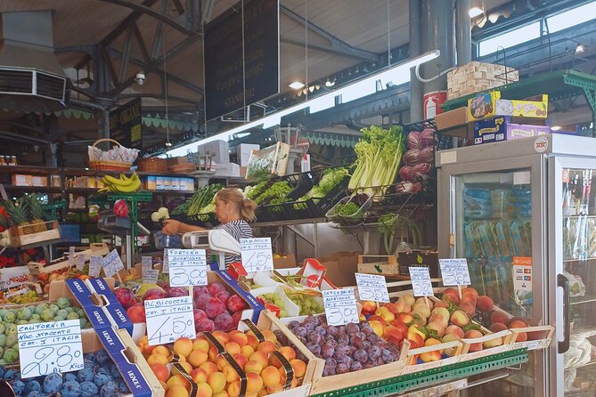 Modena walking food tour with a local - Mercato Albinelli: cheeses, cured meats, and the ciccioli moment